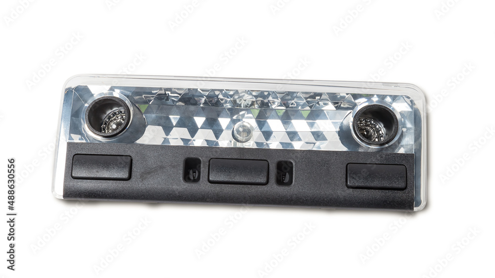 Fototapeta premium spare part from the car on a white isolated background is a cover for the illumination of a standart sign on the interior for replacement and repair. Spare parts catalog.