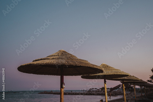 umbrellas on the beach at sunset