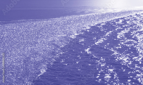 Vászonkép Ice crystals in a lazy line  floating on a sea of periwinkle water