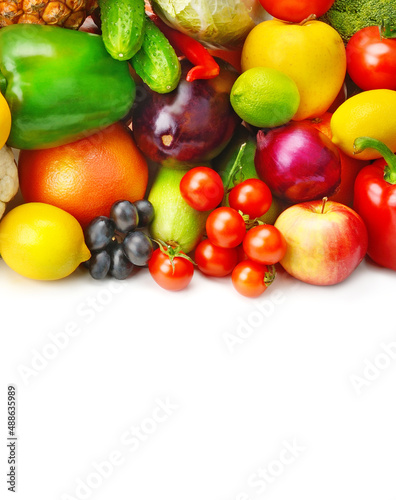 Fruits and vegetables isolated on white background. Vertical photo. Free space for text.