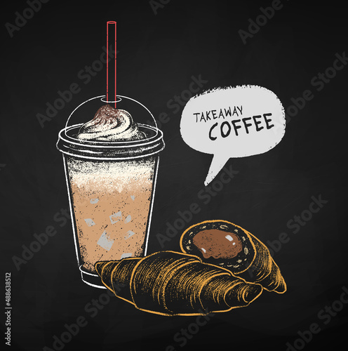 Chalk drawing of coffee cup with croissants