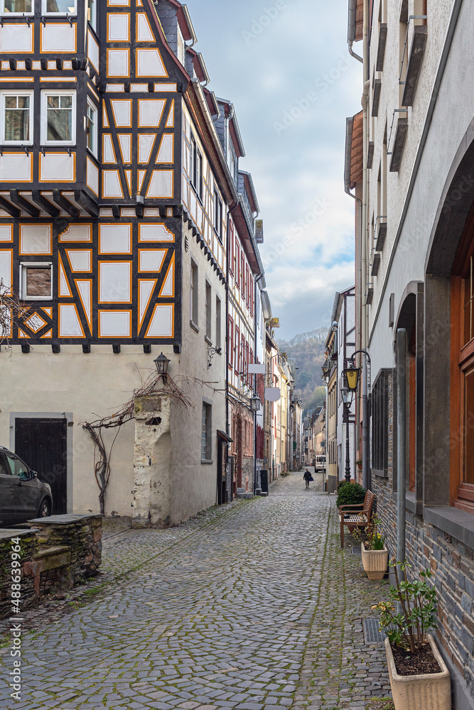 narrow cobbled street with old half-timbered houses in the small German town of Bascharach
