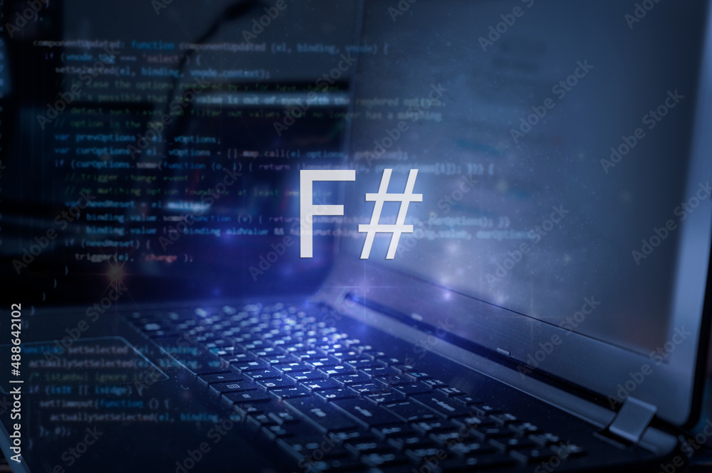 F# (F sharp) inscription against laptop and code background. Technology concept. Learn programming language.