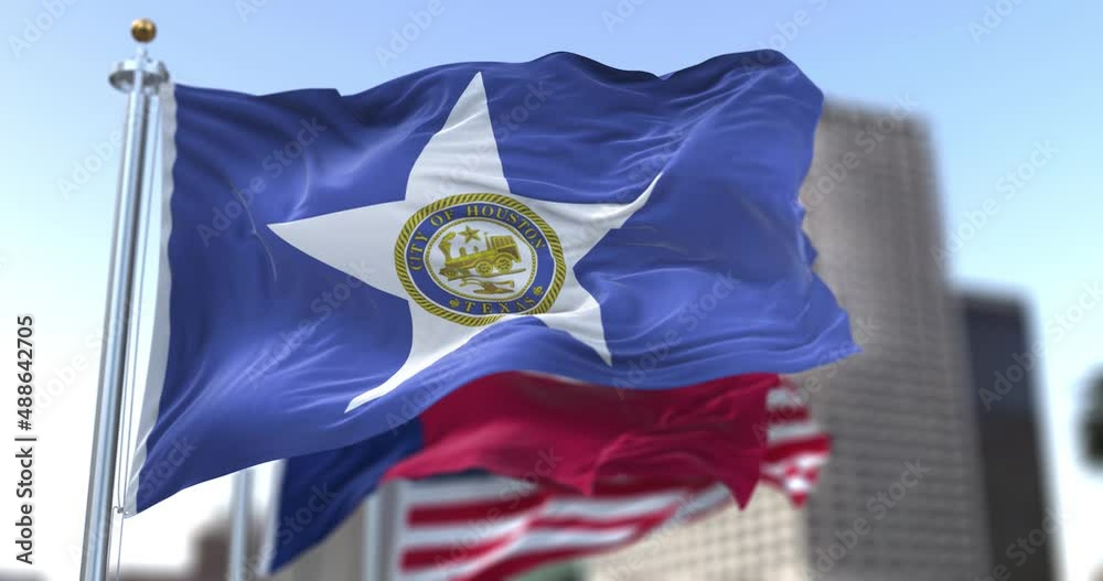 Houston city flag waving in the wind with Texas state and United States national flags