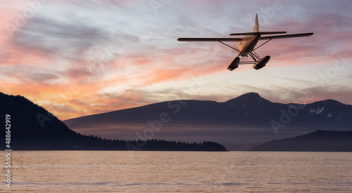Seaplane flying over Canadian Mountain Nature Landscape on the Pacific West Coast. Cloudy Winter Sunset. 3d Rendering Airplane Adventure Concept. Vancouver, British Columbia, Canada. © edb3_16