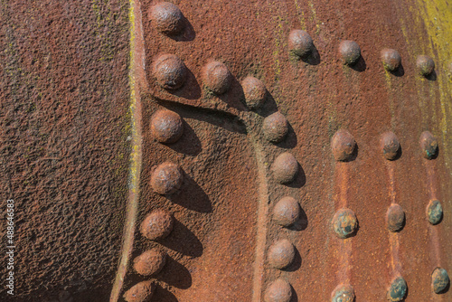 rusty metal background of an scrapped steam boilder photo