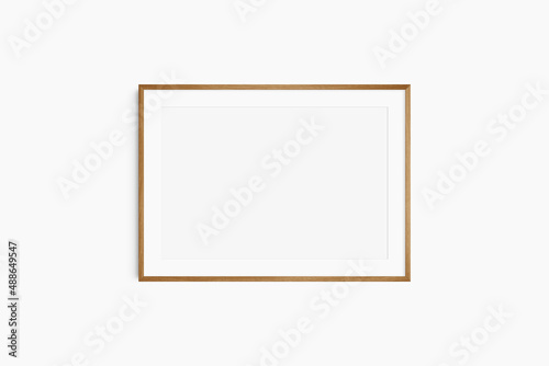 Horizontal frame mockup 7:5, 70x50, A4, A3, A2, A1 landscape. Single cherry wood frame mockup. Clean, modern, minimalist, bright. Passepartout/mat opening in 3:2 aspect ratio.