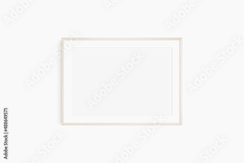 Horizontal frame mockup 7:5, 70x50, A4, A3, A2, A1 landscape. Single light wood frame mockup. Clean, modern, minimalist, bright. Passepartout/mat opening in 3:2 aspect ratio.