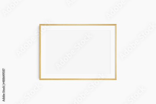 Horizontal frame mockup 7:5, 70x50, A4, A3, A2, A1 landscape. Single oak wood frame mockup. Clean, modern, minimalist, bright. Passepartout/mat opening in 3:2 aspect ratio.