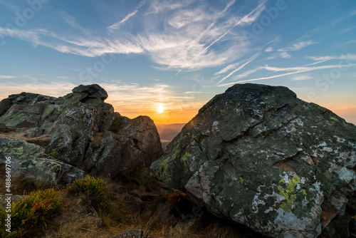 Rock formation at the summit of the Wolfwarte in the Harz Mountains at sunset photo