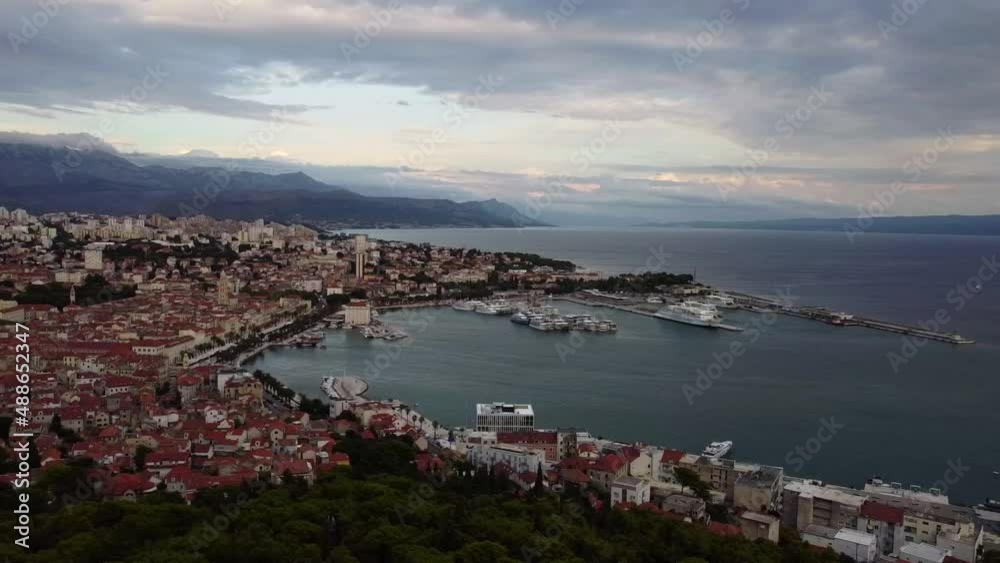 Aerial view of the sea coast and houses in Split. Historical Center, Adriatic Sea and mountains. Yachts in the marina. Dalmatia. Croatia. Europe Aerial view of the sea coast and houses in Split. Historical Center, Adriatic Sea and mountains. Yachts in the marina. Dalmatia. Croatia. Europe
