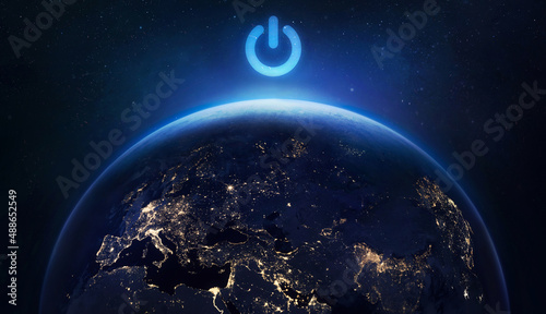 Earth hour. Turn off the light for save planet. Blackout. Earth sphere at night with cities lights. Elements of this image furnished by NASA