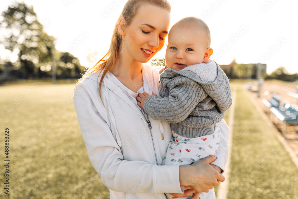 Happy Mother's Day. Adorable cute young mother with cute little son. Happy loving family. mother and baby play Happy Mother's Day. Adorable cute young mother with cute little son. Happy loving family. mother and baby play