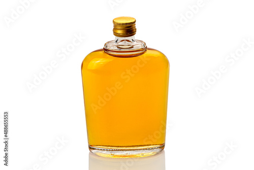 Glass whiskey hip flask, or whisky or bourbon, closeup isolated on white, clipping path