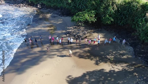 Artisanal collective fishing in Playa Hermosa aerial drone.. Traditional or subsistence fishing consists of various small-scale, low-technology, low-capital, fishing practices undertaken by individual photo