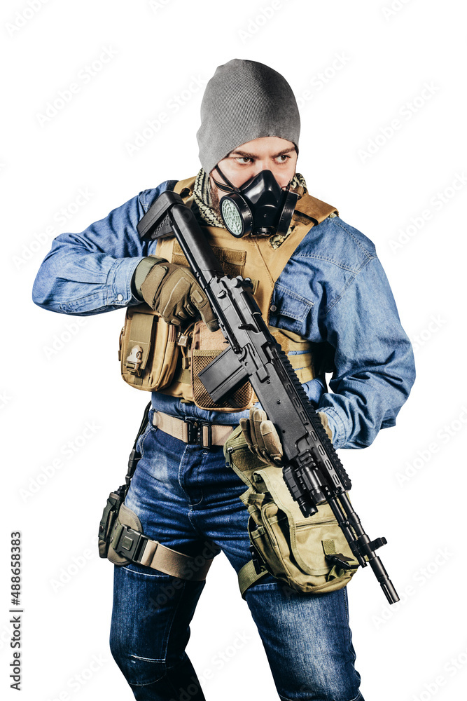 Isolated photo of urban soldier in tactical military outfit and gas mask standing with rifle and gas mask white background. Isolated photo of urban soldier in tactical military outfit and gas mask standing with rifle and gas mask white background.