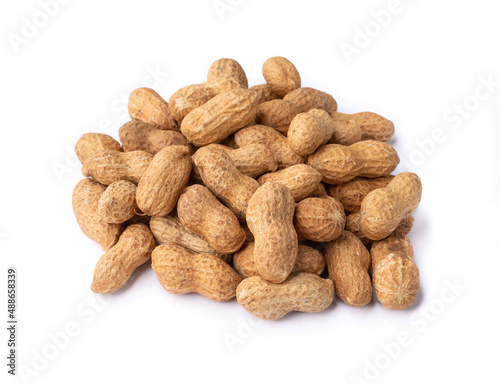 A pile of shelled peanuts isolated over white background