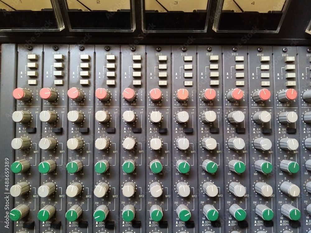 Analogue mixing console channels showing eq section and phantom power ...