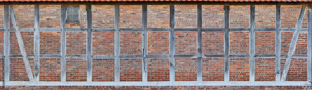 Detail of an old North German half-timbered house in Lower Saxony. Detail of an old North German half-timbered house in Lower Saxony.