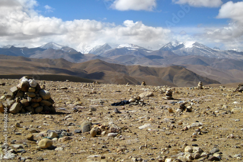 stones in the desert and view of the mountain peaks of Tibet