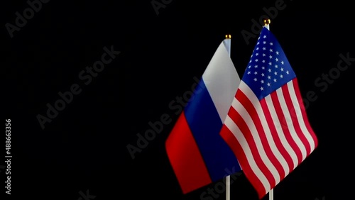 USA and Russia flag. Conflict, diplomatic relations. The concept of sanctions pressure in politics. World crisis, war. Black background photo