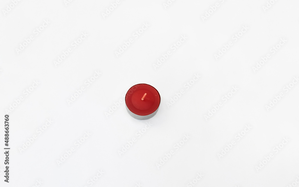 Round colored candle isolated on white. Round colored candle isolated on white.
