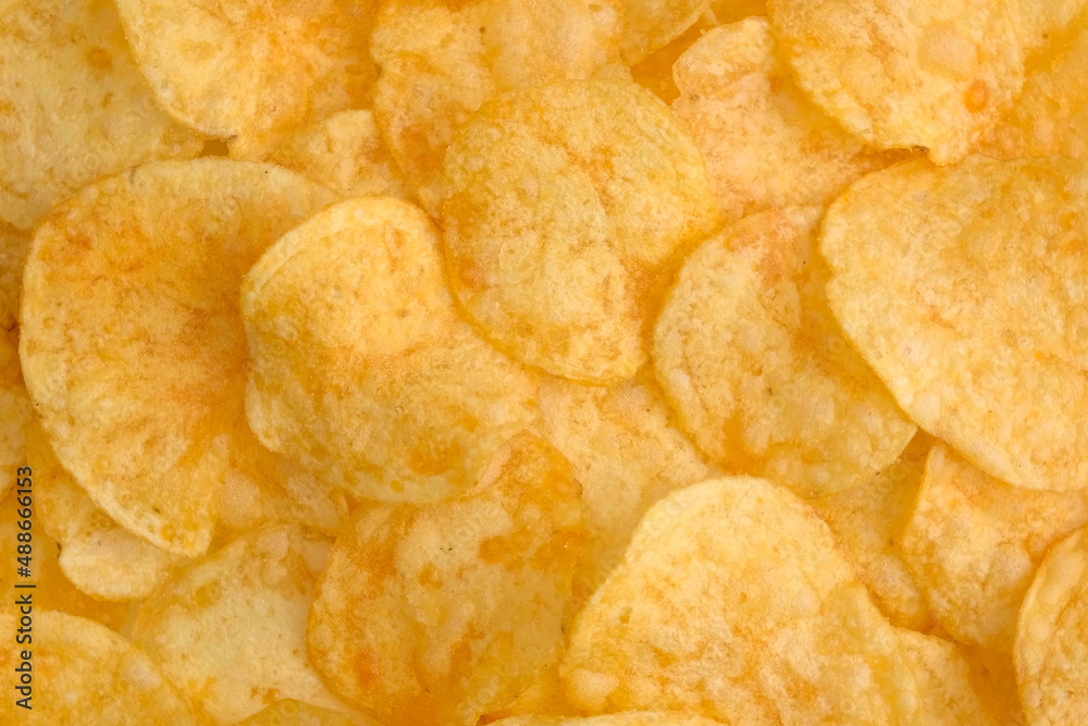 Background of Potato chips close up. Nutrition concept. Top view, copy space. Background of Potato chips close up. Nutrition concept. Top view, copy space.