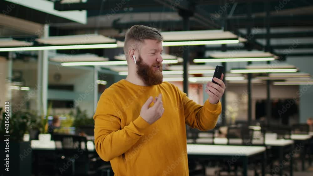 Guy Making Video Call On Cellphone Communicating Standing In Office Guy Making Video Call On Cellphone Communicating Standing In Office