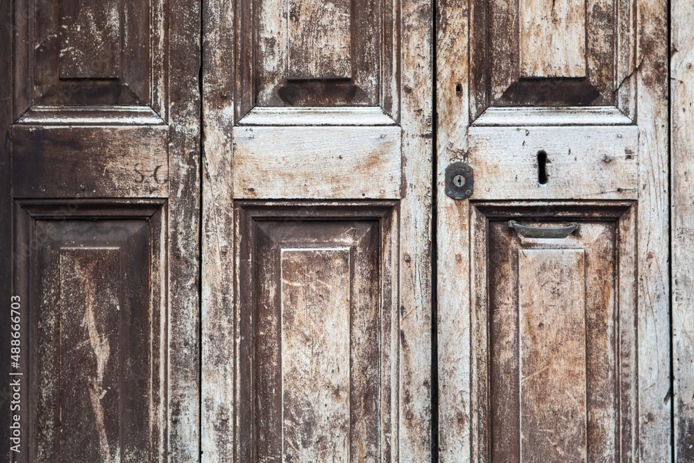 Details of ancient wooden doors of central Italy