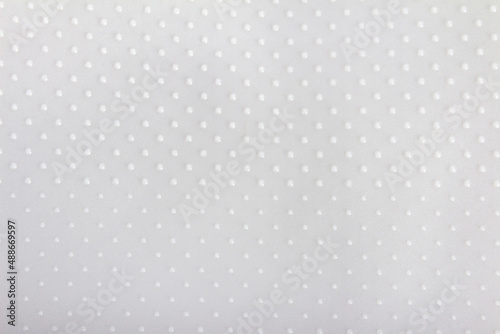 Close up texture of gray colored dotted rubber texture.