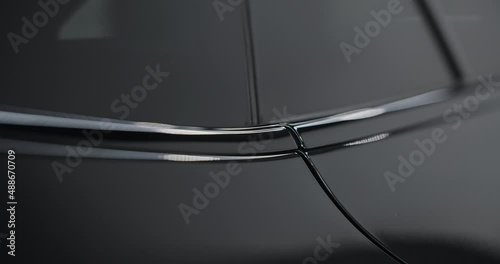 Close up of the shiny car details after hydrophobic coating application, car detaling center, automotive care, 4k 60p