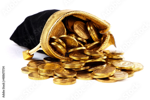 A bag with gold coins isolated on a white background. The money in a black bag. Treasure Hunt. A Purse with money. Wallet wit gold coins.