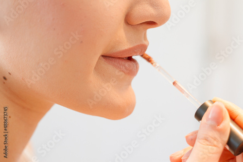 Young Woman Getting Ready For Work Doing Morning Makeup Routine