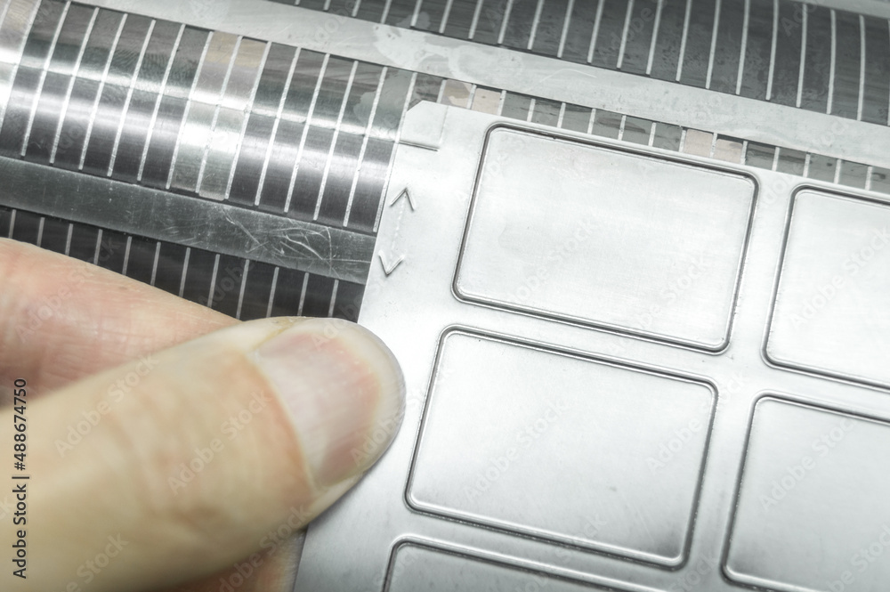 Used cylinder with attached flexible die for die cutting on