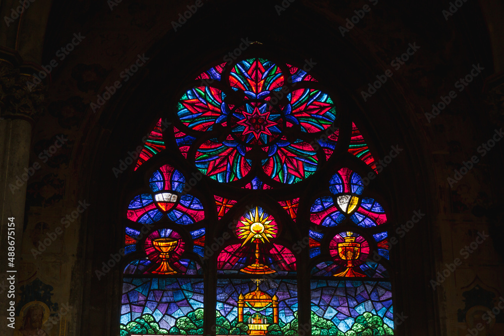 Church vitrage glass, stained glass mandalas. Interior Votive Church, Votivkirche, neo-Gothic style. 