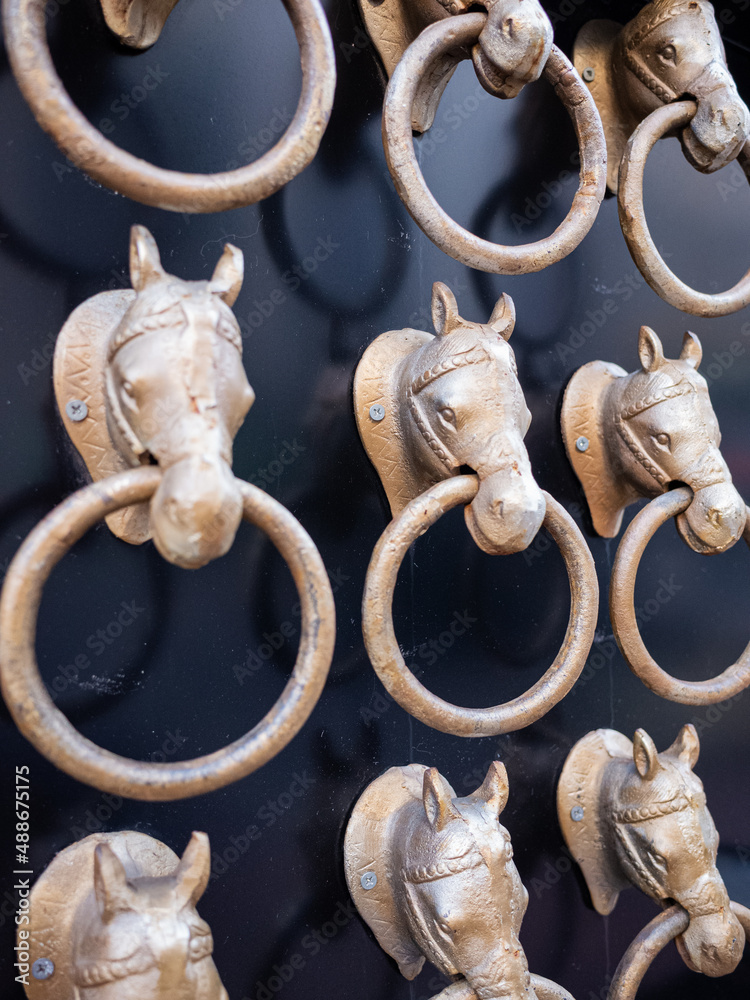 horse head shape door knockers on the wall of street in tokyo Stock