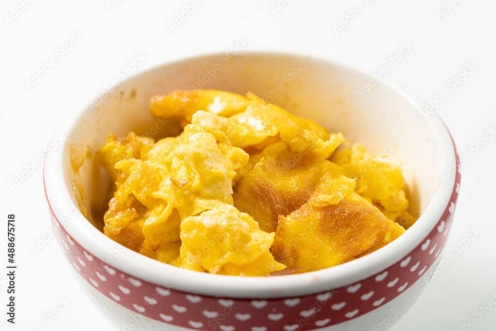 Small scrambled eggs on a monochrome background