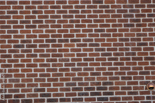 Dark brown bricks installed on the wall of the house