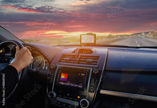 Driving on a pan american highway on a cross-country trip at sunset