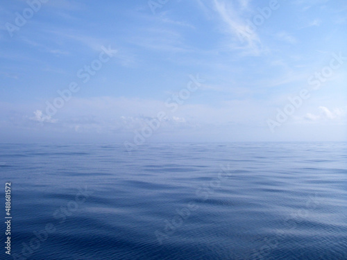 Wallpaper Mural Sunny blue sky to the dead calm blue sea surface gradation texture background image. 晴天の空から地平線へ、そのまま凪の青い海へと撮った背景、テクスチャー画像。 Torontodigital.ca