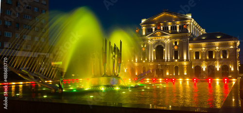 Illuminated Culture Palace with colored kinetic fountain in Drobeta Turnu-Severin at night