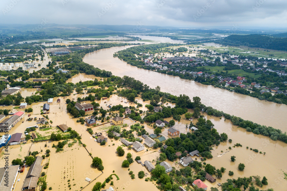 Aerial view of flooded houses with dirty water of Dnister river in Halych town, western Ukraine