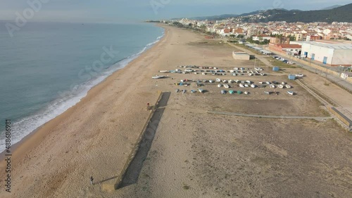 Malgrat de Mar beach in Maresme province of Barcelona Spain aerial view  Fisherman's boats in the sand photo