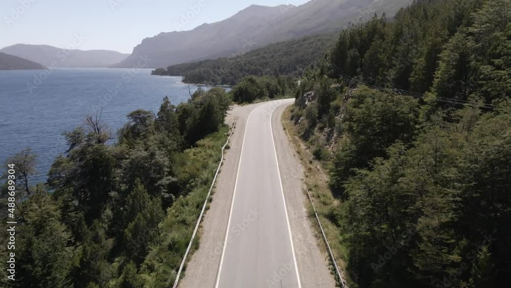 Aerial view over highway coastline in Lake Nahuel Huapi, Bariloche, Argentina, forest and mountain range Aerial view over highway coastline in Lake Nahuel Huapi, Bariloche, Argentina, forest and mountain range