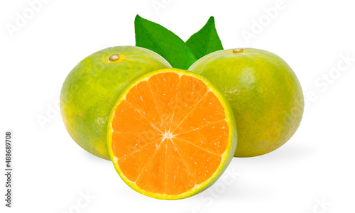 Thin peeled oranges orange fruit with cut in half and green leaves isolated on white background.