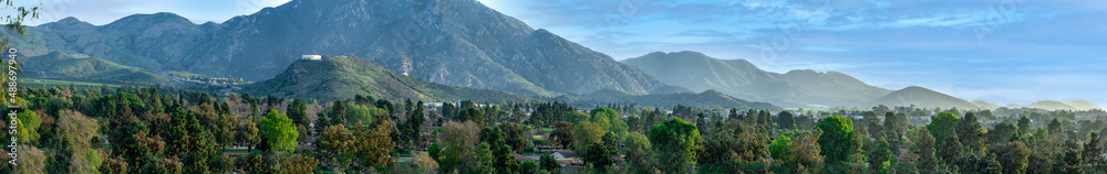 Panoramic view of valleys, citrus farms, agriculture, mountains, highways, trees, hills and homes in California