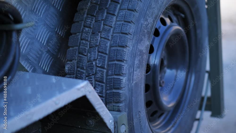 Close up front car wheel on the asphalt road. Car wheel close-up of camper van. Close up front car wheel on the asphalt road. Car wheel close-up of camper van.