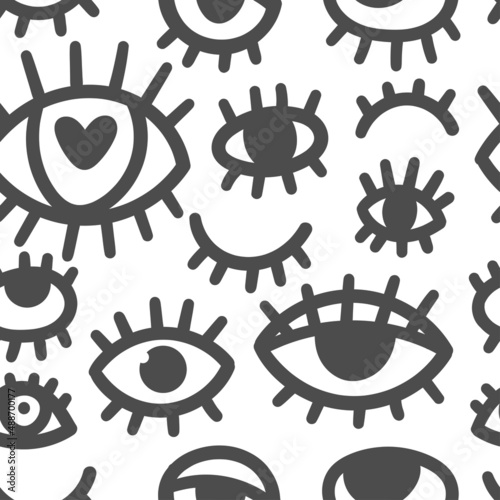 Seamless pattern with different eyes on white background. Doodle cartoon print. Line art funny wallpaper.