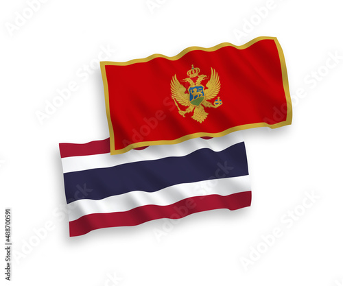 National vector fabric wave flags of Montenegro and Thailand isolated on white background. 1 to 2 proportion.