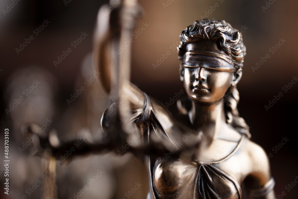Judge office. Justice symbol - Themis sculpture on brown background. Judge office. Justice symbol - Themis sculpture on brown background.